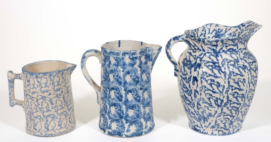 AMERICAN BLUE AND WHITE STONEWARE SPONGE-DECORATED JUGS / PITCHERS, LOT OF THREE