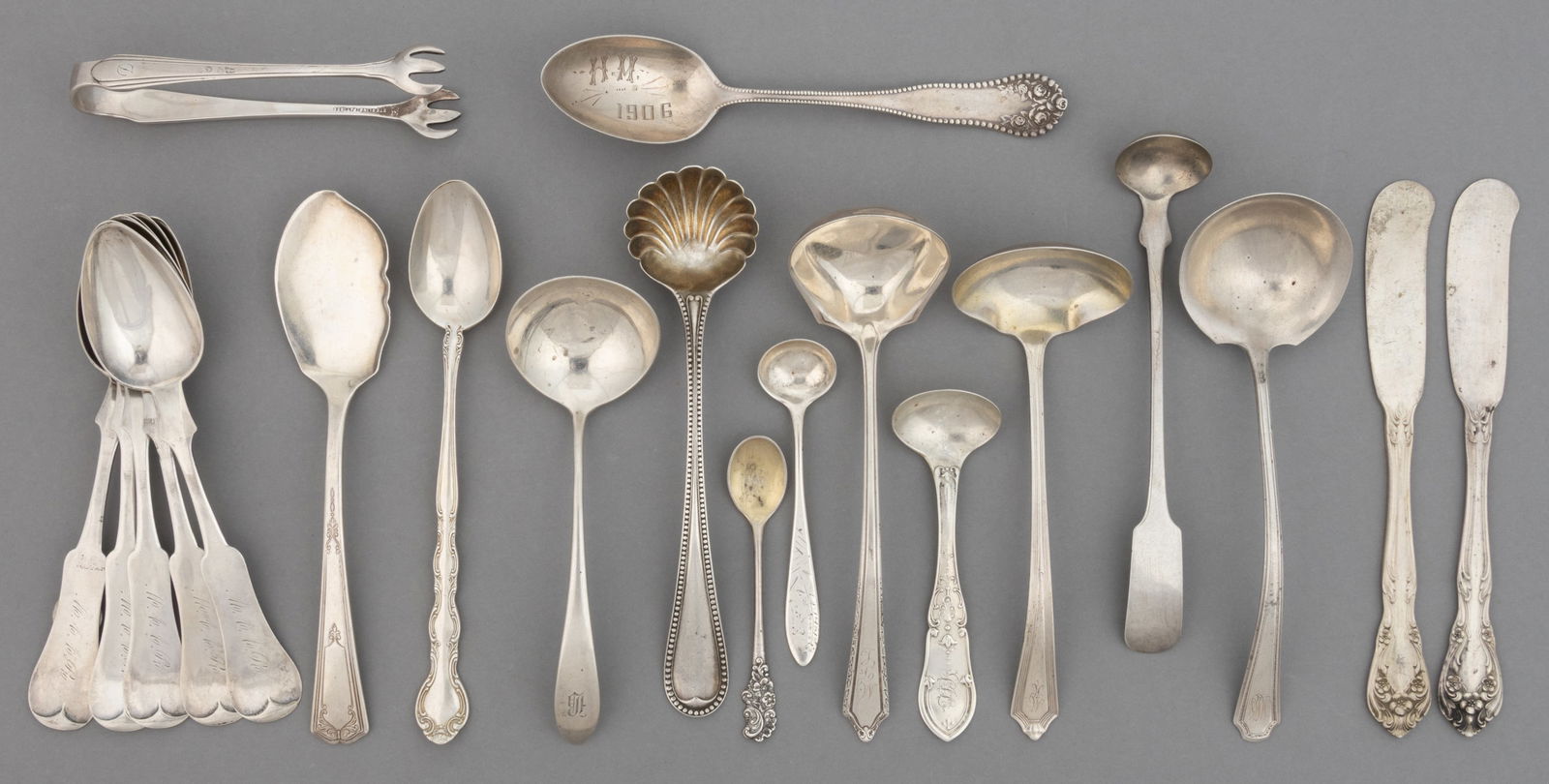 GORHAM AND OTHER STERLING AND COIN SILVER FLATWARE AND SERVING UTENSILS, LOT OF 20: GORHAM AND OTHER STERLING AND COIN SILVER FLATWARE AND SERVING UTENSILS, LOT OF 20, most pieces with personalized engravings to handles; sterling silver pieces comprising four by Gorham Mfg. Co. of Pr