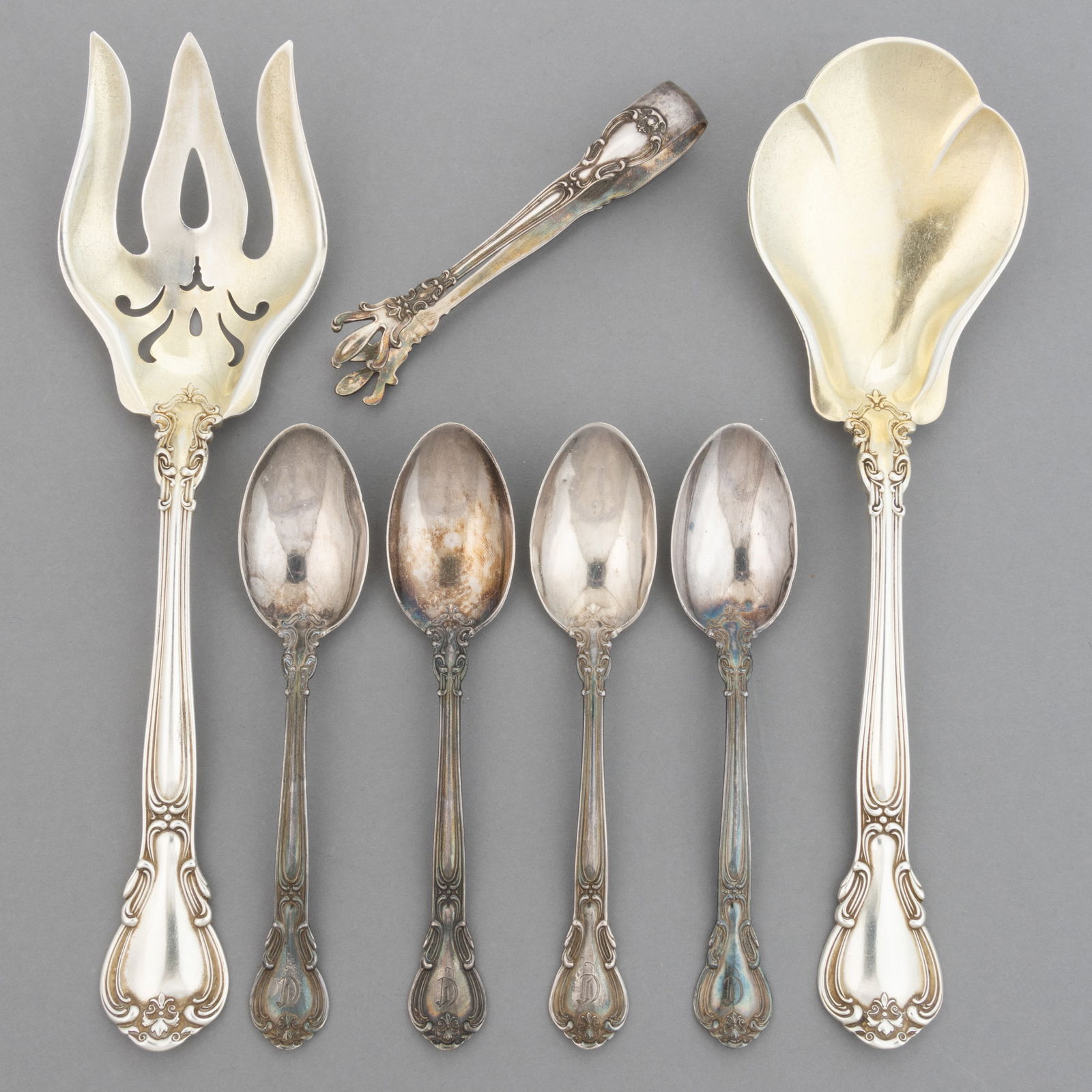 GORHAM "CHANTILLY" STERLING SILVER SPOONS AND SERVING UTENSILS, LOT OF SEVEN: GORHAM "CHANTILLY" STERLING SILVER SPOONS AND SERVING UTENSILS, LOT OF SEVEN, pattern designed in 1895 by William C. Codman, comprising a set of four youth or 4 o'clock teaspoons with en