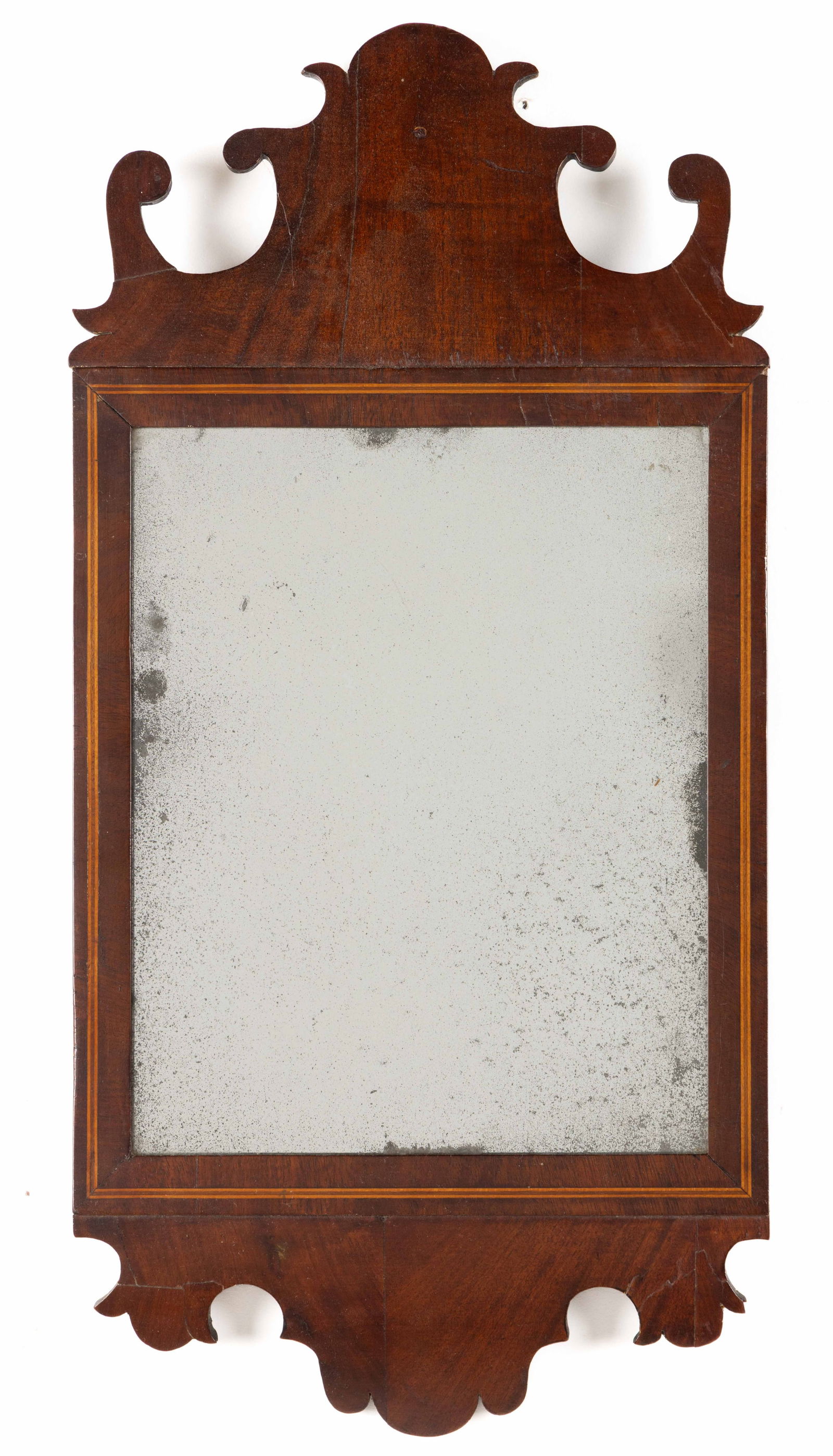 AMERICAN OR BRITISH CHIPPENDALE MAHOGANY DIMINUTIVE LOOKING GLASS / WALL MIRROR: AMERICAN OR BRITISH CHIPPENDALE MAHOGANY DIMINUTIVE LOOKING GLASS / WALL MIRROR, the inlaid veneered frame surrounding a mirror plate with an upper and lower shaped crest. Retains an old, possibly ori