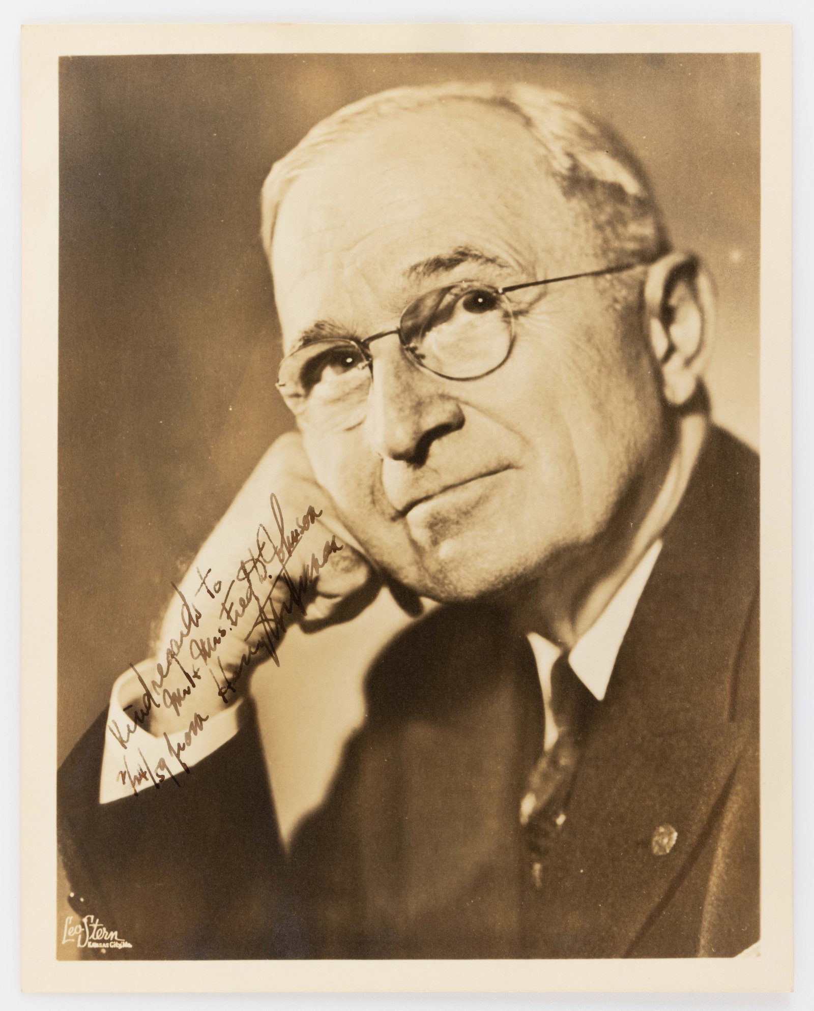 PRESIDENT HARRY S. TRUMAN SIGNED PRESENTATION PHOTOGRAPH: PRESIDENT HARRY S. TRUMAN SIGNED PRESENTATION PHOTOGRAPH, matte-finish portrait of Truman by the Leo Stern Studio of Kansas City, signed and inscribed in fountain pen, "Kind regards to 