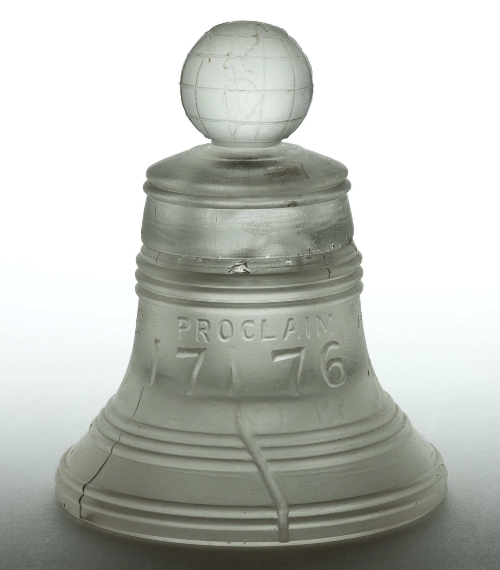 PHILADELPHIA CENTENNIAL LIBERTY BELL INKWELL: PHILADELPHIA CENTENNIAL LIBERTY BELL INKWELL, frosted colorless, from the International Exposition in 1876, embossed "PROCLAIM / 1776 / LIBERTY" to one side and "PEACE AND / 1