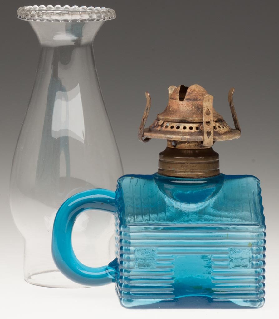 LOG CABIN / SCHOOL HOUSE FINGER LAMP - SMALL: LOG CABIN / SCHOOL HOUSE FINGER LAMP - SMALL blue, molded handle, No. 1 Taplin-Brown collar with patent information. Fitted with a period No. 0 slip burner and chimney with beaded top. Atterbury & Co.