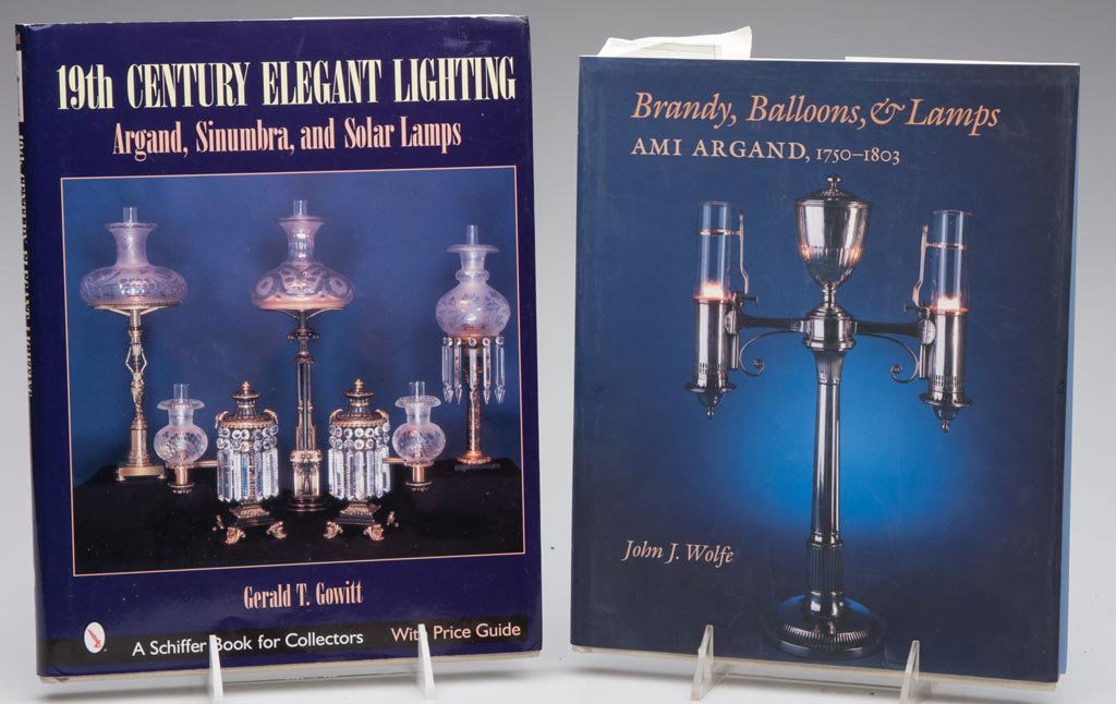 ELEGANT LIGHTING REFERENCE VOLUMES, LOT OF TWO: ELEGANT LIGHTING REFERENCE VOLUMES, LOT OF TWO comprising Gowitt, "19th Century Elegant Lighting: Argand, Sinumbra, and Solar Lamps", 2002 and Wolfe, "Brandy, Balloons, & Lamps: Ami Argand, 1750-1803"