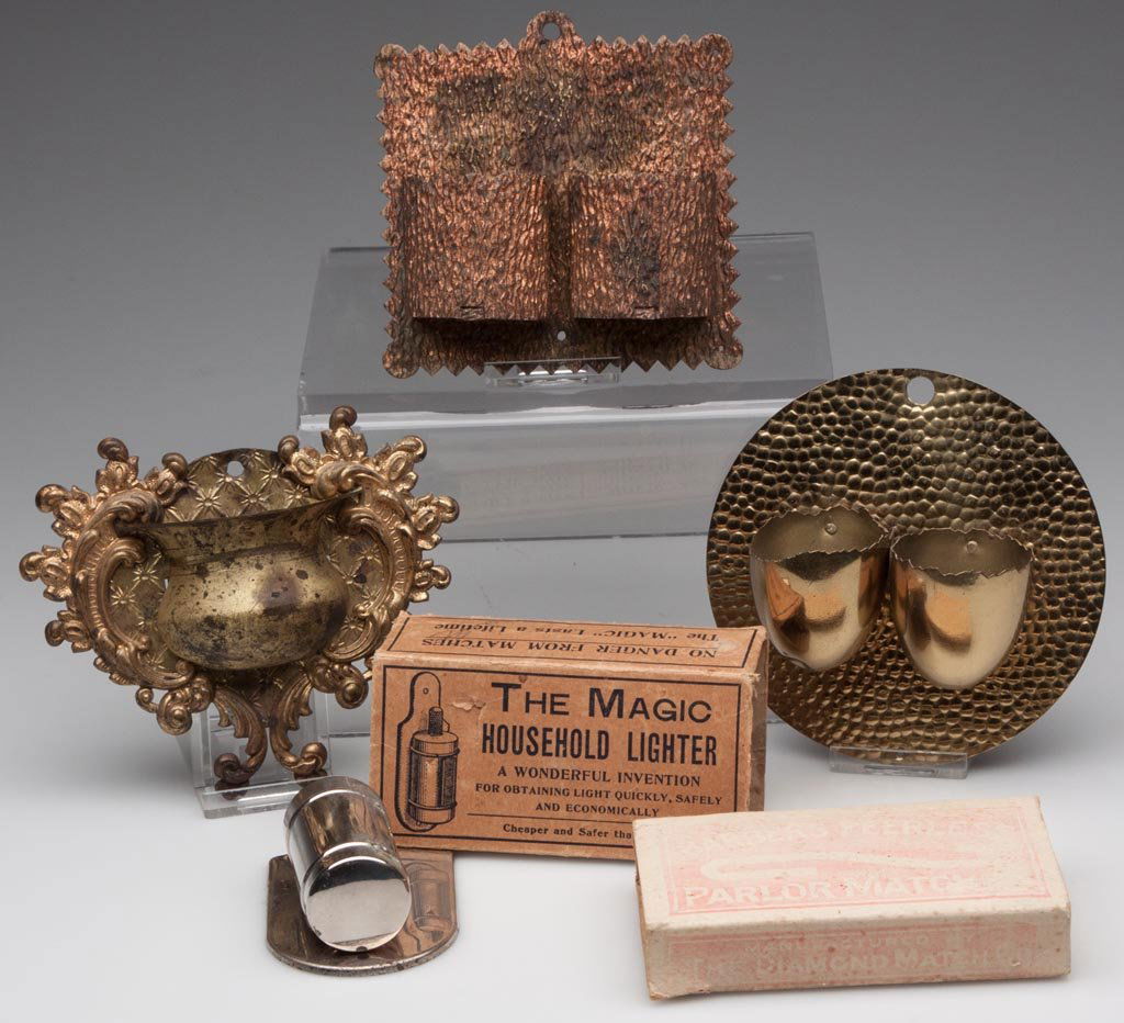 VARIOUS LIGHTING RELATED ACCESSORIES, LOT OF FIVE: VARIOUS LIGHTING RELATED ACCESSORIES, LOT OF FIVE including three brass wall match holders. Fourth quarter 19th/first quarter 20th century. Largest 4 1/2" H. Provenance: From the collection of Kerry B
