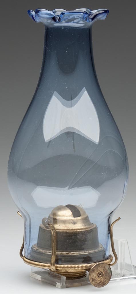 LIGHT BLUE NO. 0 SLIP CHIMNEY WITH BURNER: LIGHT BLUE NO. 0 SLIP CHIMNEY WITH BURNER eight-petal top, fitted on a period burner, thumbwheel marked "PAT. NOV. 26 72 / PAT. FEB. 11.73". Fourth quarter 19th century. 6 1/2" HOA, chimney 5 7/8" HOA