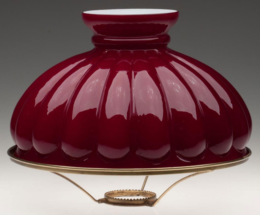 MELON RIBBED SHADE: MELON RIBBED SHADE, cased dark burgundy. Fitted on a period brass shade ring. Fourth quarter 19th century. 7 3/8" H, 11 15/16" D fitter. Provenance: From the collection of the late Dorothy J. Gooch.