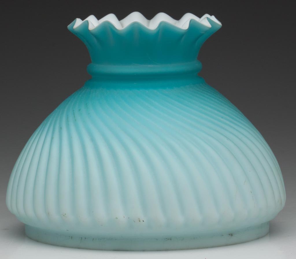 RIBBED AND SWIRLED SATIN UMBRELLA-FORM SHADE: RIBBED AND SWIRLED SATIN UMBRELLA-FORM SHADE, cased deep to light blue, scalloped top. Late 19th/early 20th century. 4 7/8" H, 5 1/2" D fitter. Literature: Parallels Miller/Solverson - Student Lamps o