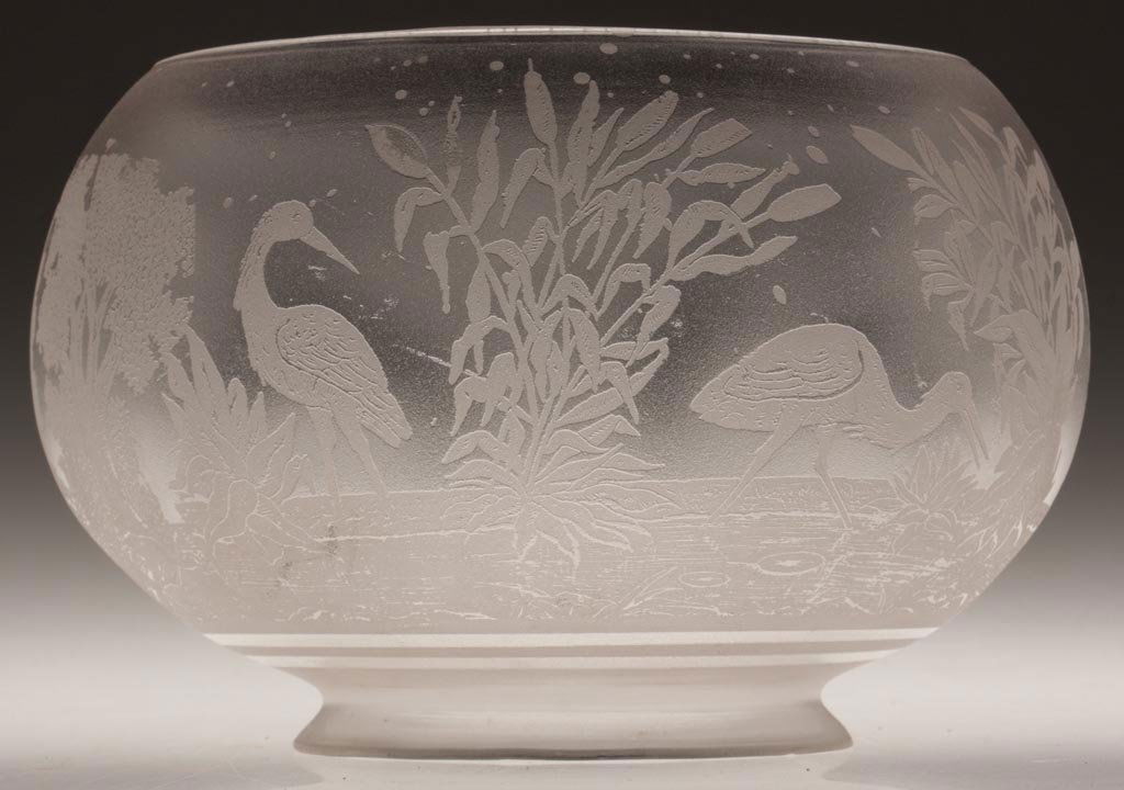 FROSTED AND ACID-ETCHED SQUAT-FORM SHADE: FROSTED AND ACID-ETCHED SQUAT-FORM SHADE, colorless, cranes in marsh with cattails and trees. Fourth quarter 19th century. 4 7/8" H, 4" D fitter. Literature: Pattern parallels Thuro III, p. 248b. Prov