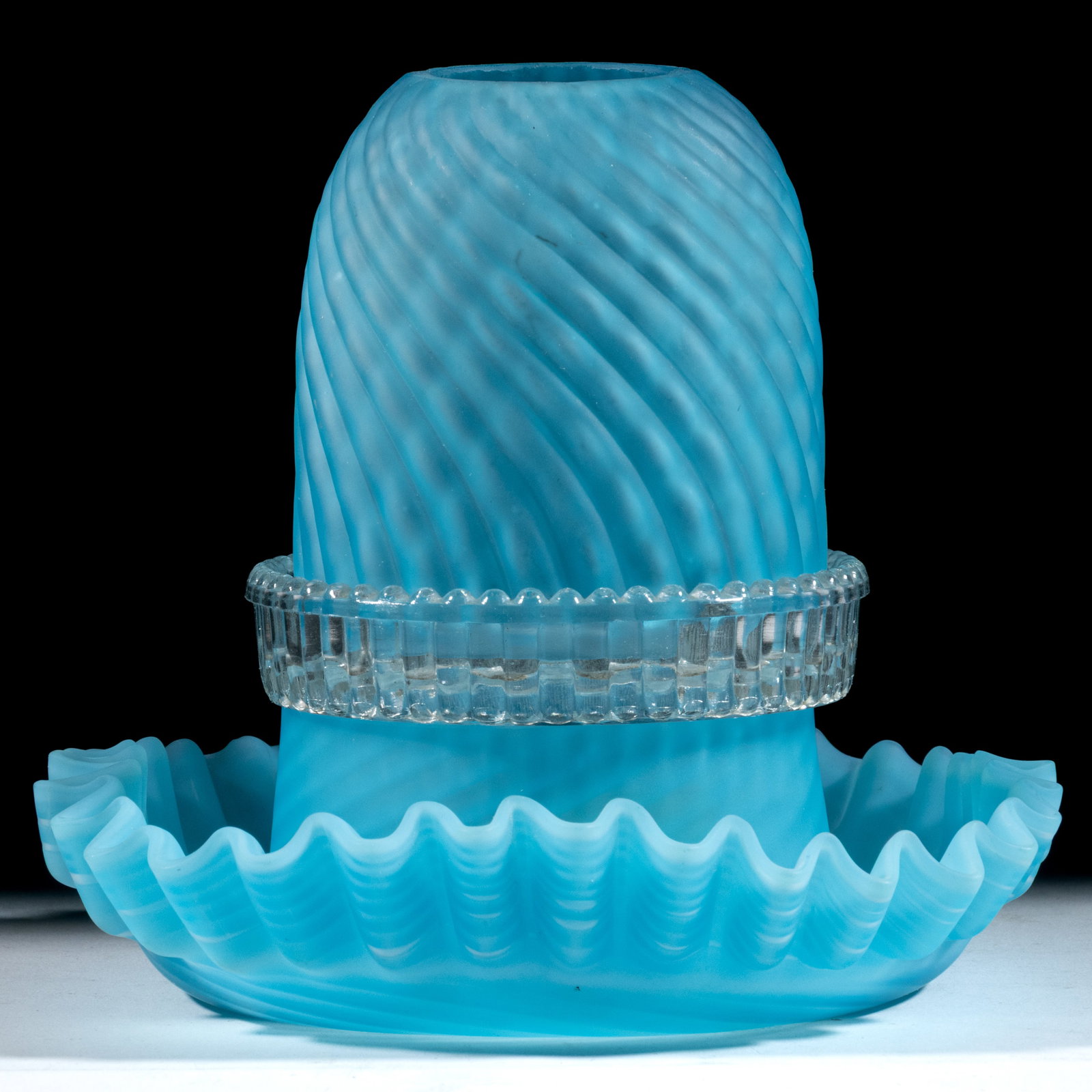 SATIN OPALESCENT REVERSE SWIRL FAIRY LAMP: SATIN OPALESCENT REVERSE SWIRL FAIRY LAMP, blue with spiraling opal ribs, satin finish, fairy-size dome with fitter having three as-made cut-out air-vents, three-part construction comprising