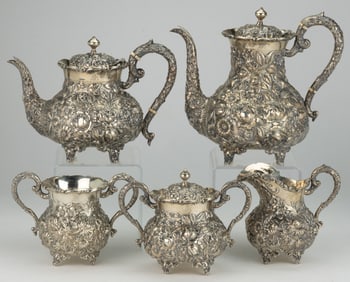 BALTIMORE, MARYLAND REPOUSSE STERLING SILVER FIVE-PIECE COFFEE AND TEA SERVICE