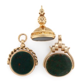 ANTIQUE AND VINTAGE BRITISH 9K GOLD AND STONE WATCH FOBS / PENDANTS, LOT OF THREE
