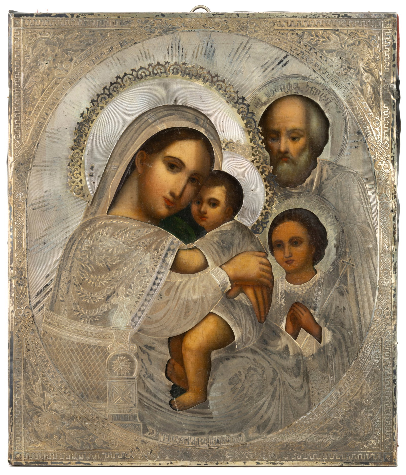 RUSSIAN ORTHODOX MADONNA AND CHILD RELIGIOUS ICON: RUSSIAN ORTHODOX MADONNA AND CHILD RELIGIOUS ICON, paint on wooden panel with a 0.875 silver riza, depicting the Madonna and child with a saint and another figure, possibly an angel, to the side. The 
