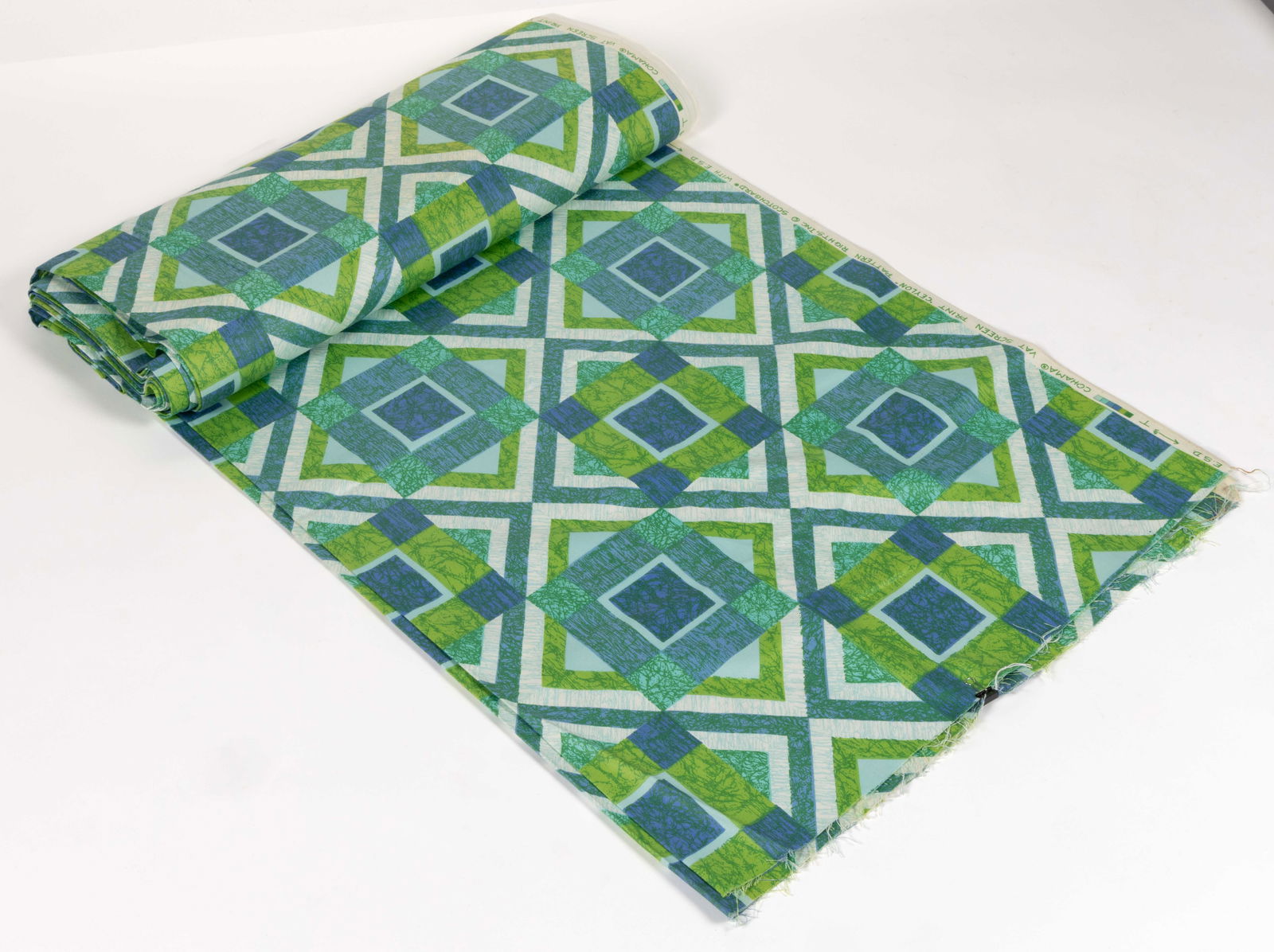VINTAGE COHAMA "CEYLON" SCREEN PRINT FABRIC: VINTAGE COHAMA "CEYLON" SCREEN PRINT FABRIC, multi-tones of green in a geometrical patterned of squares and x's with various patterns, edge is stamped "COHAMA VAT SCR