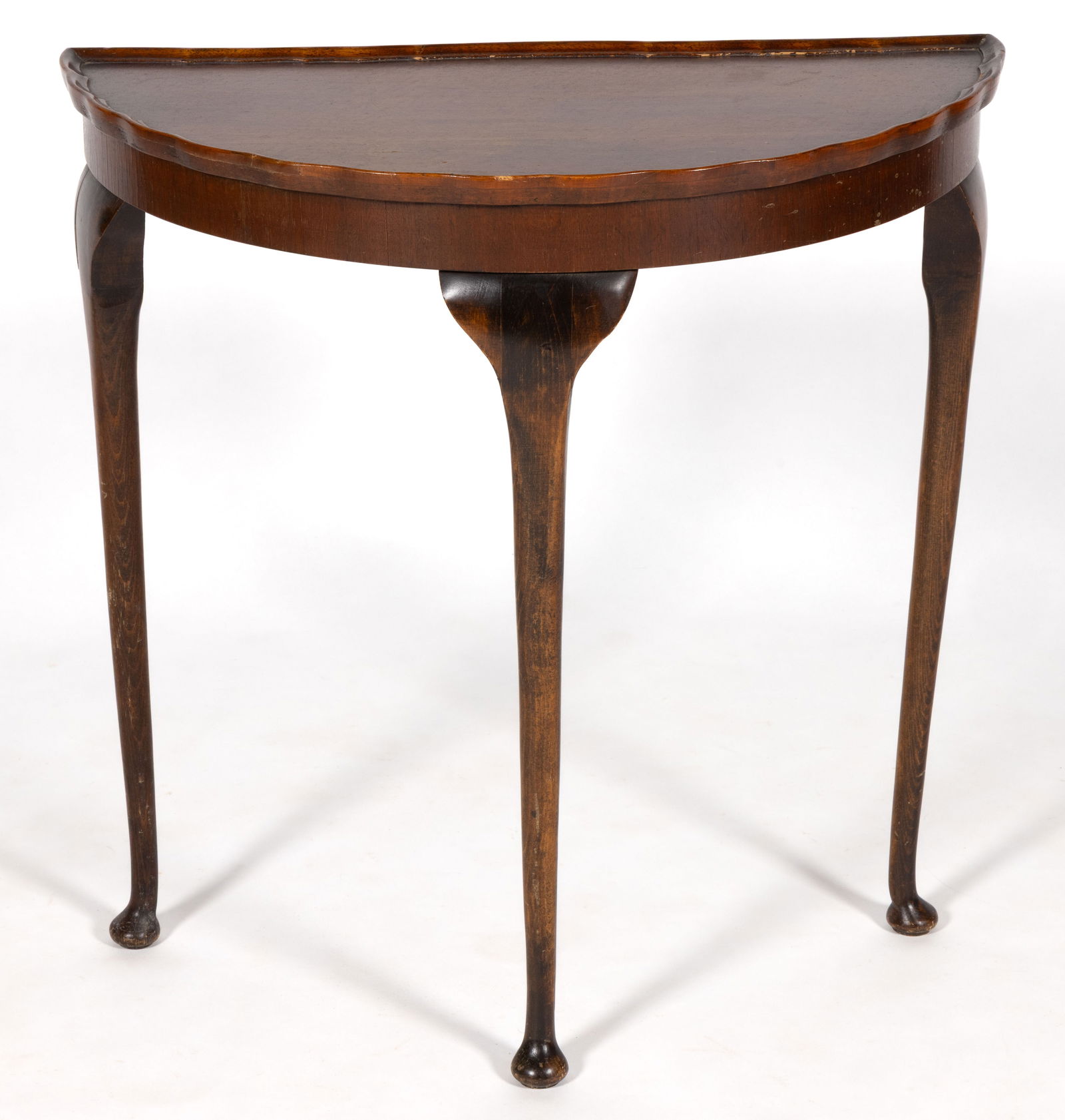 ENGLISH QUEEN ANNE-STYLE DEMILUNE CONSOLE TABLE: ENGLISH QUEEN ANNE-STYLE DEMILUNE CONSOLE TABLE, the shaped dish top on all edges of the top over a plain apron, the whole raised on tall very lightly curved cabriole-style legs which terminate in pad