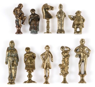 BRITISH BRASS FIGURAL NOVELTY PIPE TAMPERS, LOT OF TEN