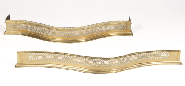 ENGLISH GEORGIAN BRASS SERPENTINED AND PIERCED FIREPLACE FENDERS, LOT OF TWO