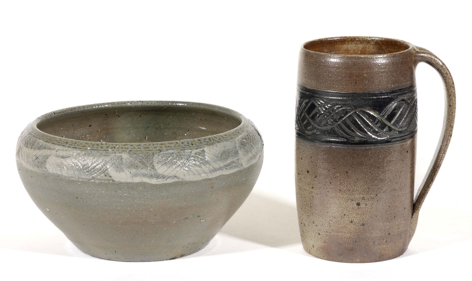 JUGTOWN, NORTH CAROLINA DECORATED STONEWARE ARTICLES, LOT OF TWO: JUGTOWN, NORTH CAROLINA DECORATED STONEWARE ARTICLES, LOT OF TWO, salt-glazed, each having a band with incised decorations, comprising an 8 3/8" DOA bowl with white-glazed border band and a tanka