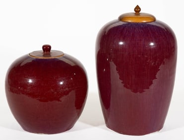 CHINESE OXBLOOD / SANG DE BOEUF PORCELAIN COVERED JARS, LOT OF TWO
