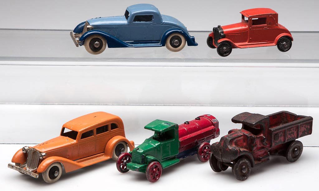 ASSORTED METAL TOY VEHICLES, LOT OF FIVE: ASSORTED METAL TOY VEHICLES, LOT OF FIVE, comprising three Tootsie Toy automobiles and two unmarked trucks. First half 20th century. 2 1/2" to 4" L. Provenance: From the Rudolph Evers estate collectio