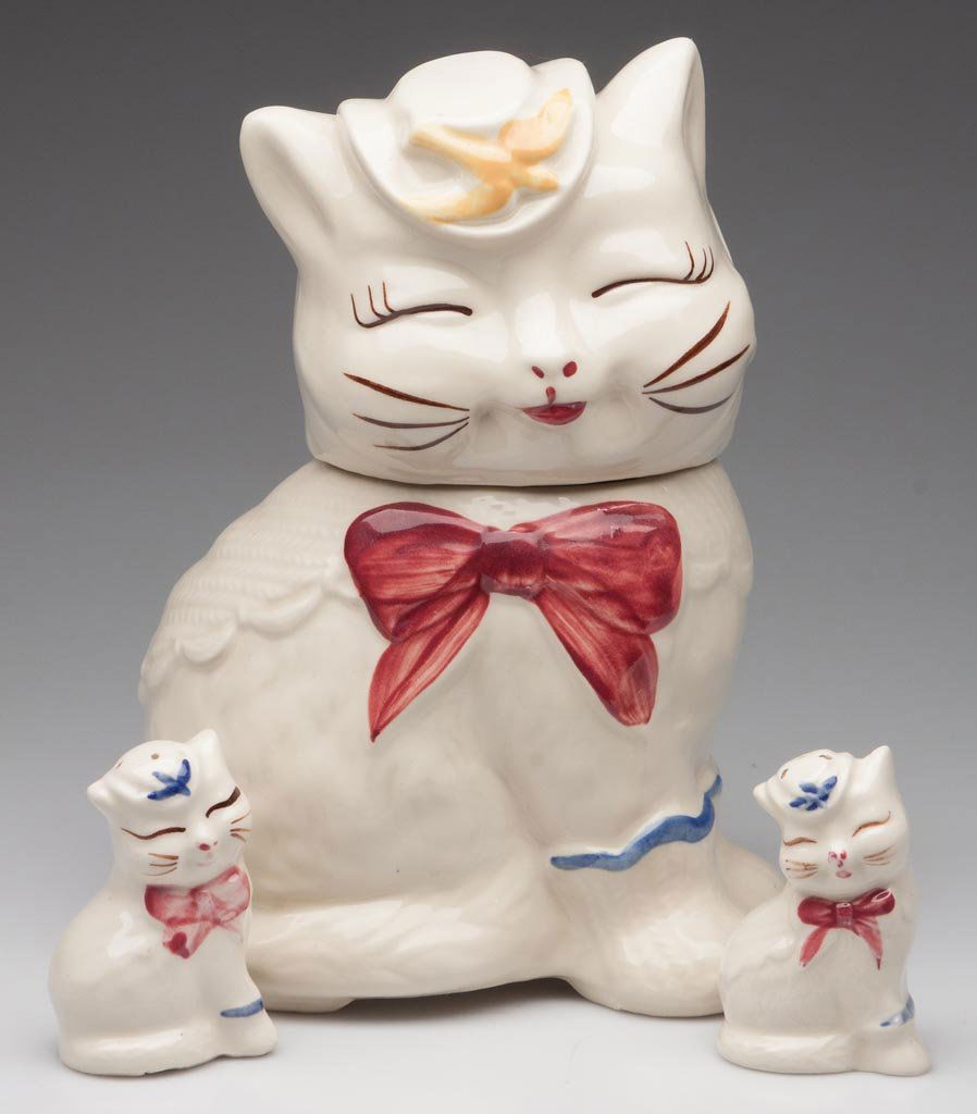 SHAWNEE POTTERY "PUSS 'N' BOOTS" ARTICLES, LOT OF THREE: SHAWNEE POTTERY "PUSS 'N' BOOTS" ARTICLES, LOT OF THREE, comprising a cookie jar and pair of salt and pepper shakers. Mid 20th century. 10" and 3 1/4" H. Provenance: From the Rudolph Evers estate coll