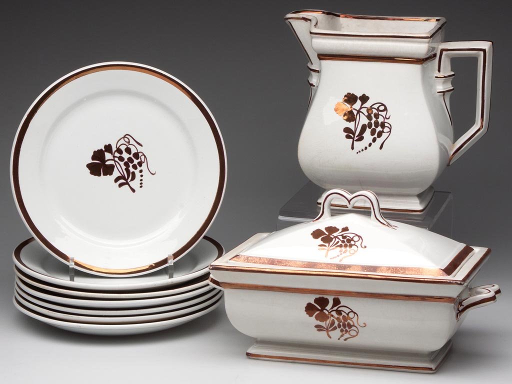 ENGLISH "TEA LEAF WITH BERRY / COFFEEBERRY" IRONSTONE A: ENGLISH "TEA LEAF WITH BERRY / COFFEEBERRY" IRONSTONE ARTICLES, LOT OF NINE, comprising a covered vegetable dish, a milk pitcher, each of rectangular form, and seven plates, all with copper-luster dec