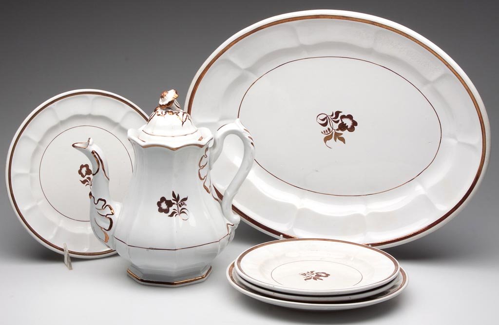 ENGLISH "MORNING GLORY" IRONSTONE ARTICLES, LOT OF SIX: ENGLISH "MORNING GLORY" IRONSTONE ARTICLES, LOT OF SIX, comprising a teapot, platter, and four plates in two sizes, each with copper-luster decoration, pot unmarked, remainder with impressed mark for 