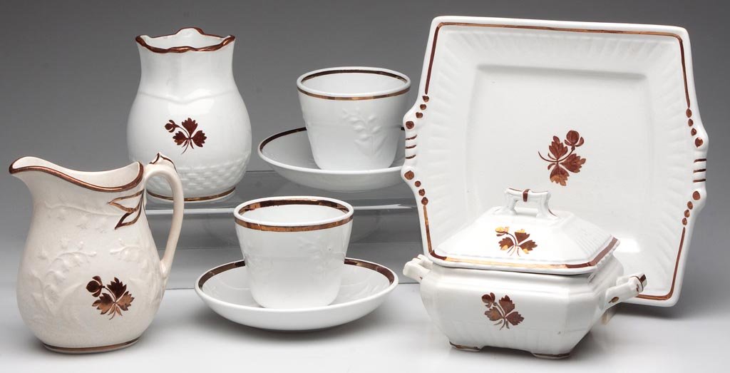 ENGLISH "TEA LEAF" IRONSTONE ARTICLES, LOT OF EIGHT: ENGLISH "TEA LEAF" IRONSTONE ARTICLES, LOT OF EIGHT, comprising a soap dish with drainer, a square serving plate, pair of handless cups and saucers, creamer and toothbrush holder, each with molded des