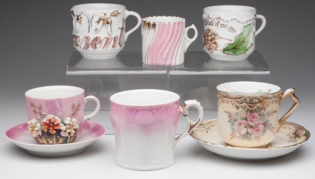 ASSORTED CHINA MUSTACHE CUPS, LOT OF THREE: ASSORTED CHINA MUSTACHE CUPS, LOT OF THREE, two marked "Germany", unmarked example with saucer. Along with a plain cup and saucer and two mugs. Six pieces total. Late 19th/first quarter 20th century. 