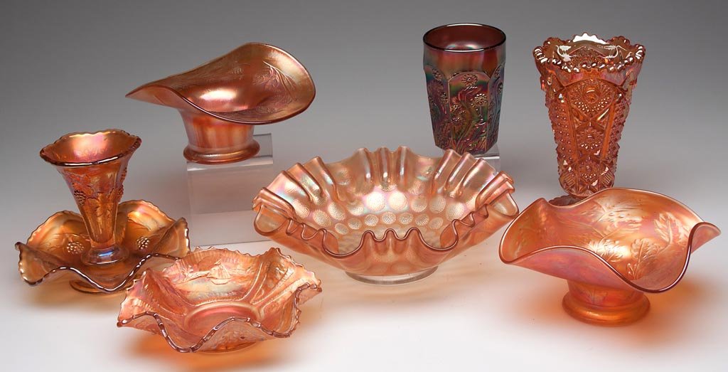VARIOUS PATTERNS CARNIVAL GLASS ARTICLES, LOT OF SEVEN: VARIOUS PATTERNS CARNIVAL GLASS ARTICLES, LOT OF SEVEN, marigold, comprising four bowls including Blackberry Spray, Holly, and Sailboat and one other, a Nucut vase and a Vintage epergne. Together with