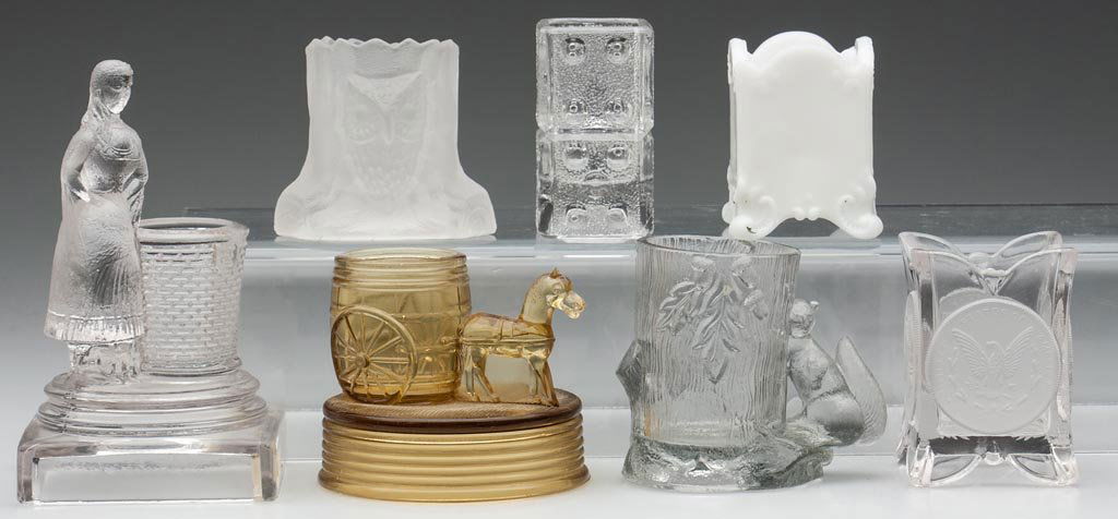 VARIOUS PRESSED GLASS TOOTHPICK / MATCH HOLDERS, LOT OF: VARIOUS PRESSED GLASS TOOTHPICK / MATCH HOLDERS, LOT OF SEVEN, including an amber Central No. 865 / Horse Pulling Barrel and a frosted Owl in Stump. Fourth quarter 19th/early 20th century. 2 1/2" to 5