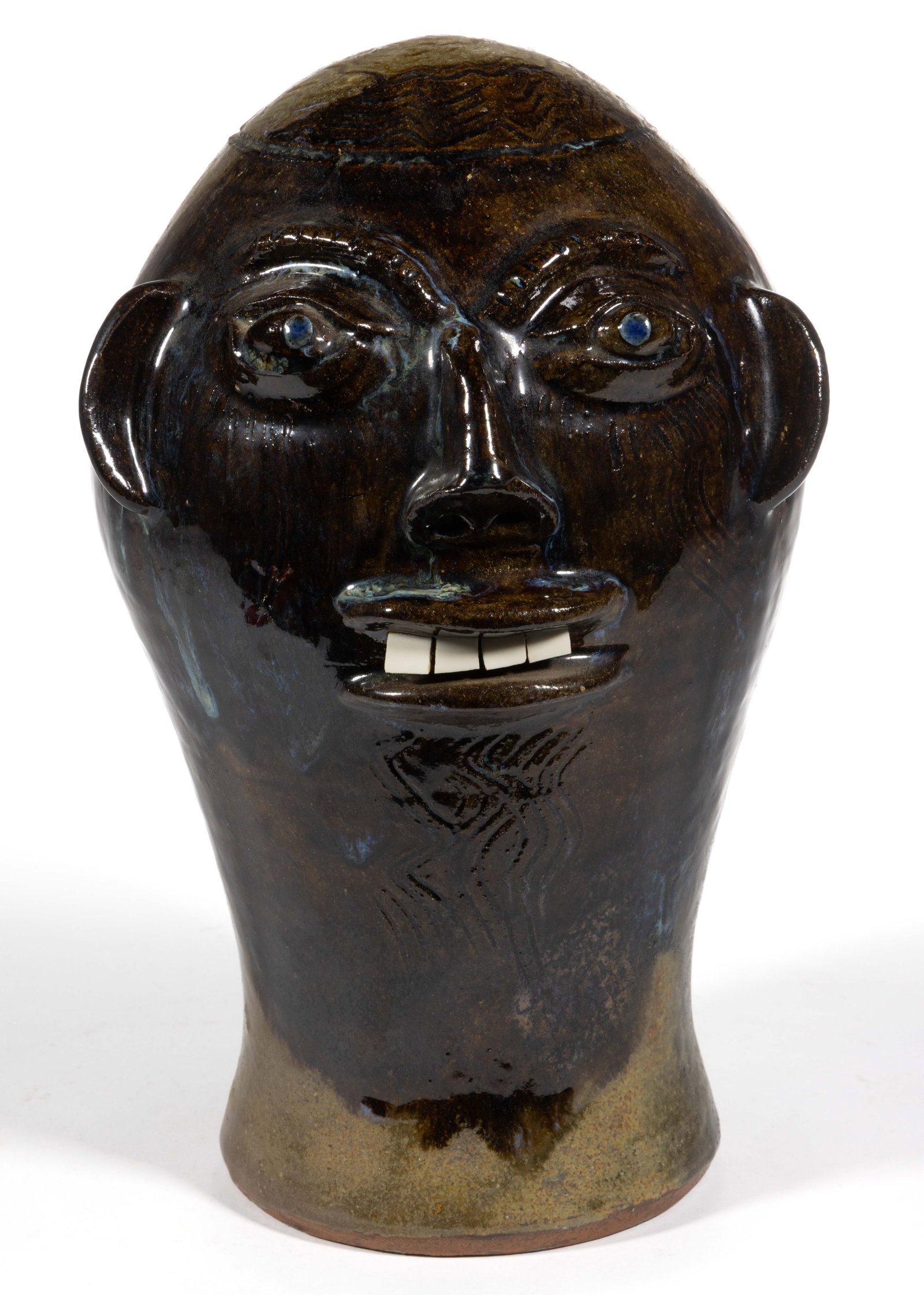 SIGNED "WALTER P. FLEMING" (AMERICAN, B. 1938), NORTH CAROLINA FACE WIG STAND: SIGNED "WALTER P. FLEMING" (AMERICAN, B. 1938), NORTH CAROLINA FACE WIG STAND, alkaline-glaze with blue rutile drips, hand-modeled having applied eyebrows and nose with nostrils, protru