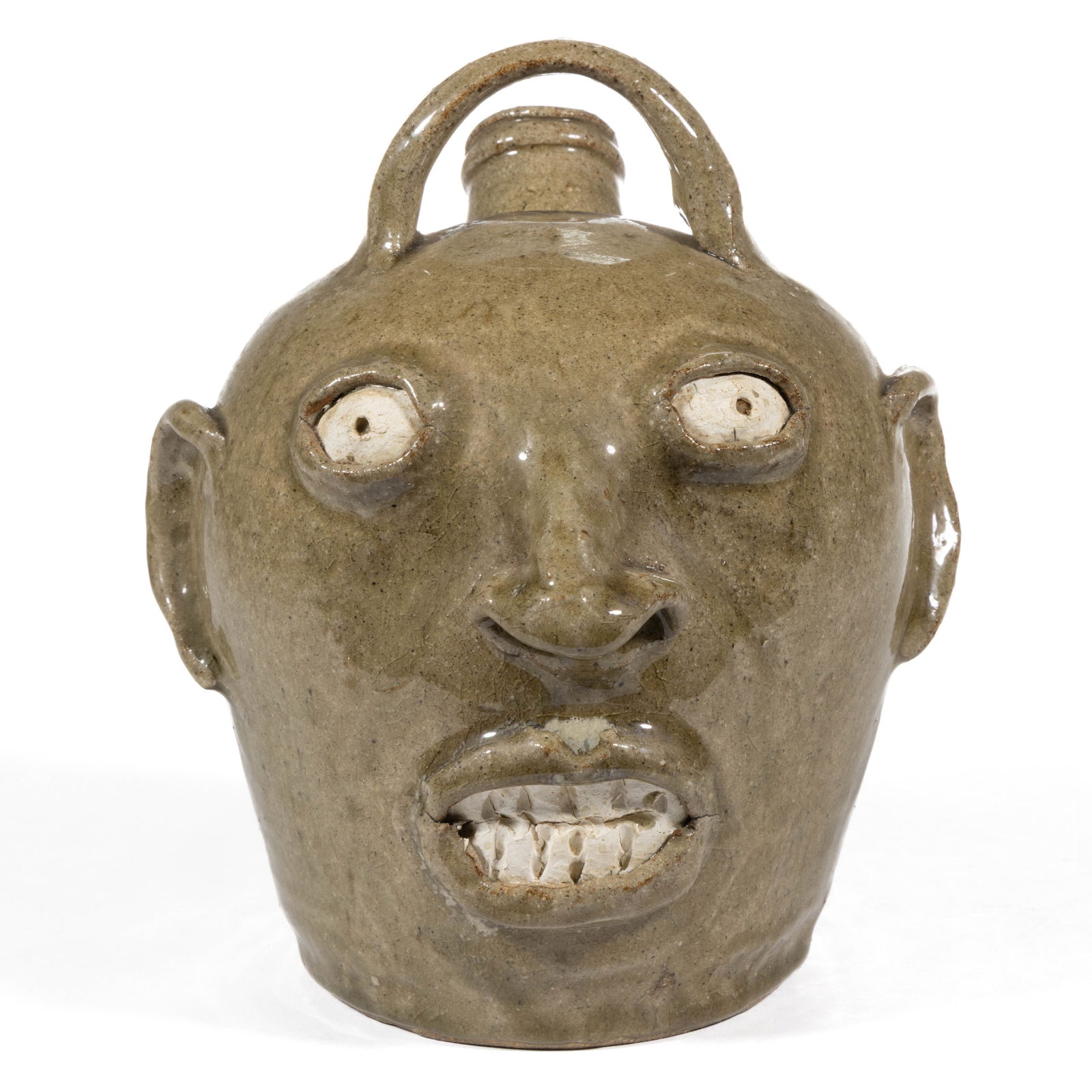 JIM BOZEMAN (AMERICAN, 1956-2015), SOUTH CAROLINA STONEWARE FACE / MONKEY JUG: JIM BOZEMAN (AMERICAN, 1956-2015), SOUTH CAROLINA STONEWARE FACE / MONKEY JUG, alkaline-glazed, having horizontal strap handle to top and a ringed mouth spout to back of head, hand-modeled with i