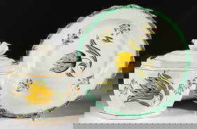 BRITISH PEARLWARE HAND-PAINTED FLORAL MOTIF CERAMIC TEA AND TABLE ARTICLES, LOT OF TWO: BRITISH PEARLWARE HAND-PAINTED FLORAL MOTIF CERAMIC TEA AND TABLE ARTICLES, LOT OF TWO, each having bold polychrome yellow and brown tulip design surrounded by sprigs, comprising an 8" D green sh