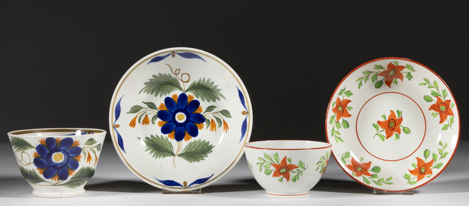 BRITISH PEARLWARE HAND-PAINTED FLORAL MOTIF CERAMIC CUP AND SAUCER SETS, LOT OF TWO (1 of 6)