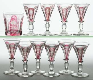 BOHEMIAN CRANBERRY-STAINED CUT-FLUTED GLASS DRINKING ARTICLES, LOT OF 11