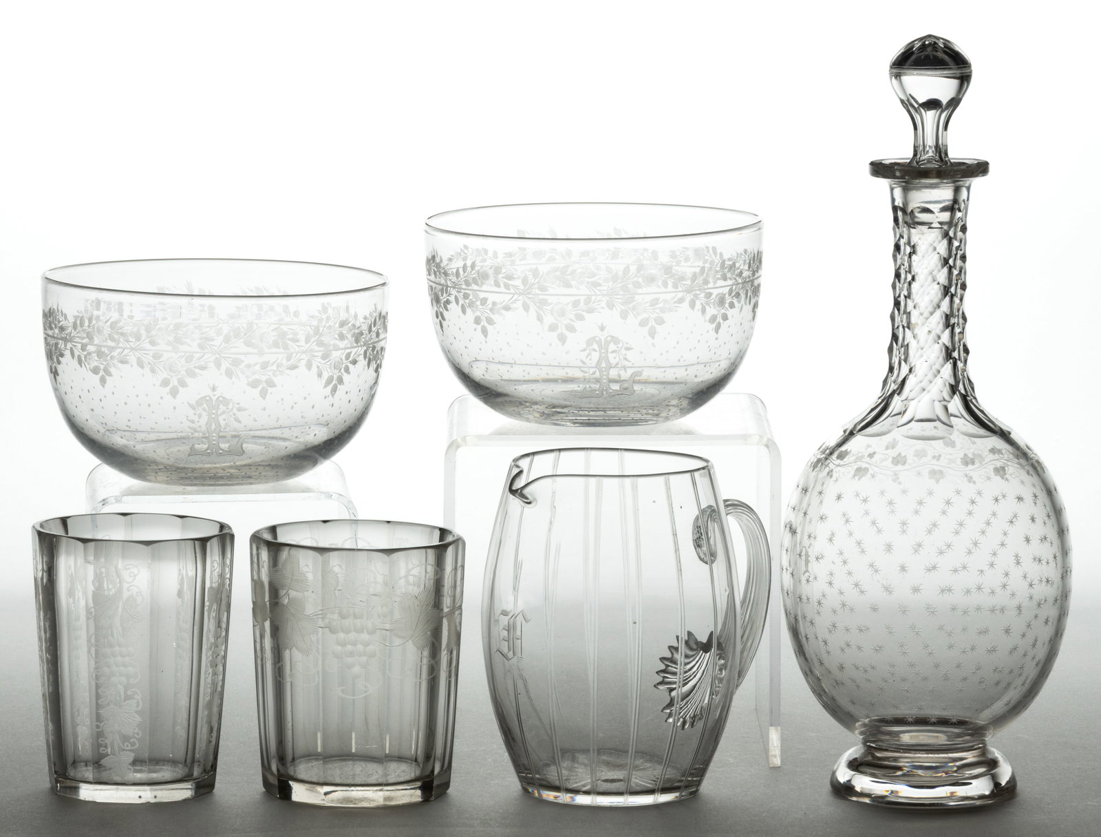 BLOWN AND ENGRAVED GLASS DRINKING ARTICLES, LOT OF SIX: BLOWN AND ENGRAVED GLASS DRINKING ARTICLES, LOT OF SIX, colorless, comprising a decanter with a small globular body, diamond cut neck, and rounded dome foot and air-trap stopper. Decanter marked "