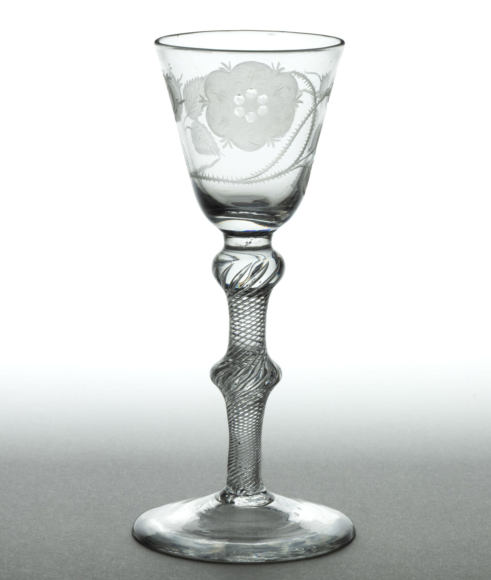 ENGLISH FREE-BLOWN AND ENGRAVED AIR-TWIST BALUSTROID WINE GLASS: ENGLISH FREE-BLOWN AND ENGRAVED AIR-TWIST BALUSTROID WINE GLASS, colorless lead glass, pointed round funnel bowl, finely engraved with a Jacobite rose, two buds, four leaves, and a moth, raised o