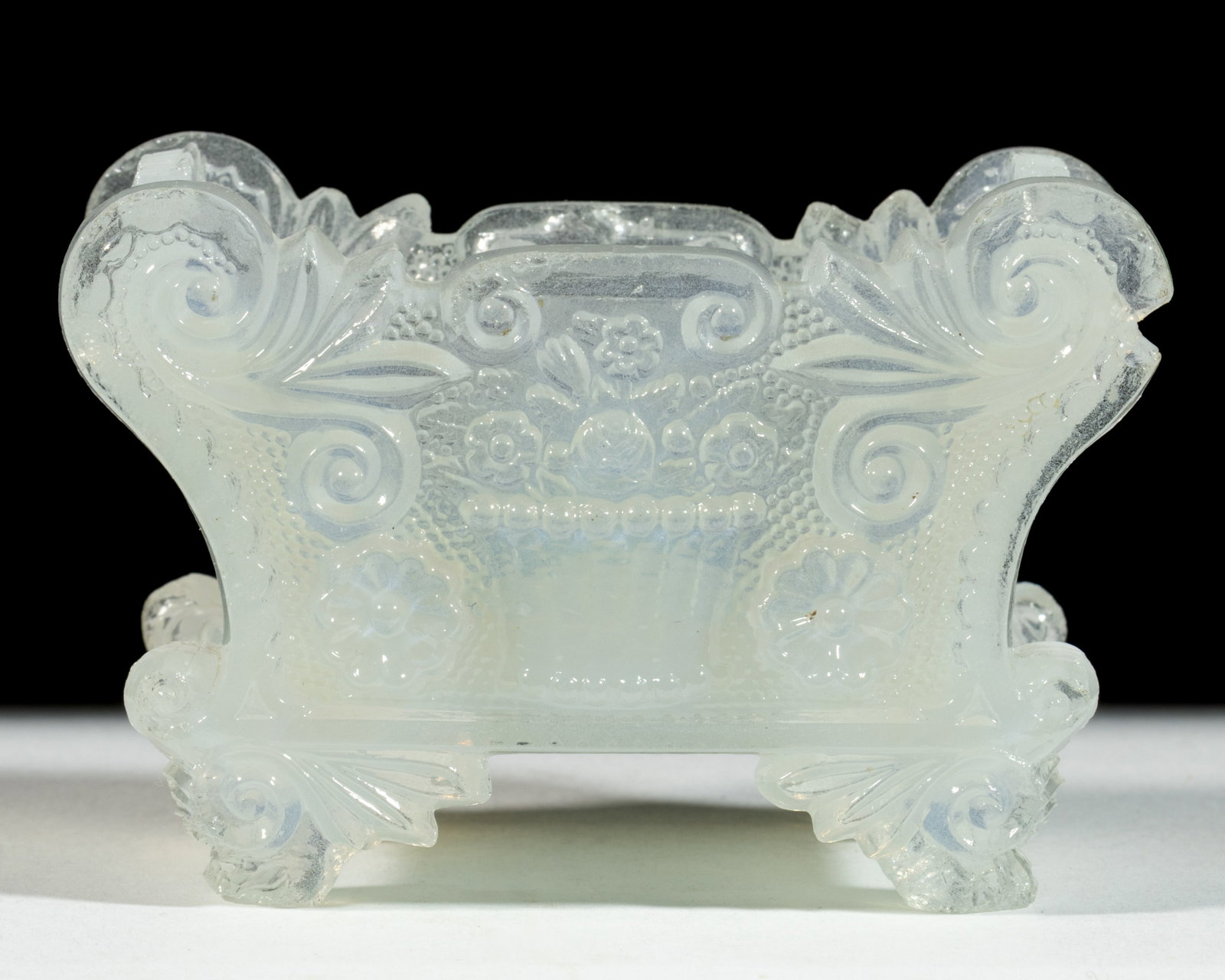 BF-1F VARIANT BASKET OF FLOWERS PRESSED OPEN SALT: BF-1F VARIANT BASKET OF FLOWERS PRESSED OPEN SALT, unlisted fiery opalescent moonstone, one end rim tab stippled, on four feet. Unknown rarity, probably very rare. Boston & Sandwich Glas