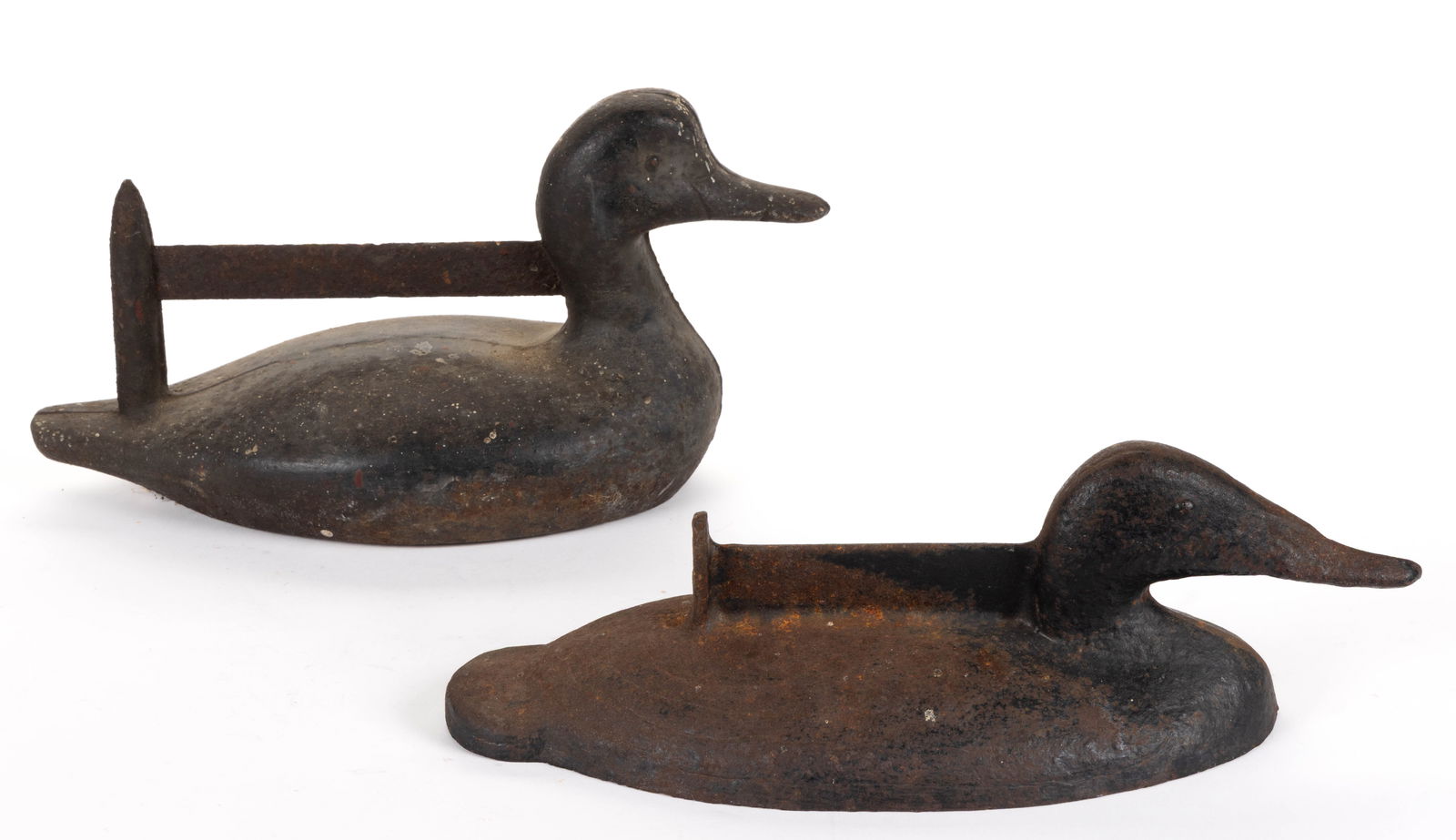CAST-IRON SINK-BOX STYLE FIGURAL DUCK DECOY BOOT SCRAPERS, LOT OF TWO: CAST-IRON SINK-BOX STYLE FIGURAL DUCK DECOY BOOT SCRAPERS, LOT OF TWO, one piece construction with flat bottoms, solid bodies with each having convex eyes, one example with molded scraper and cro