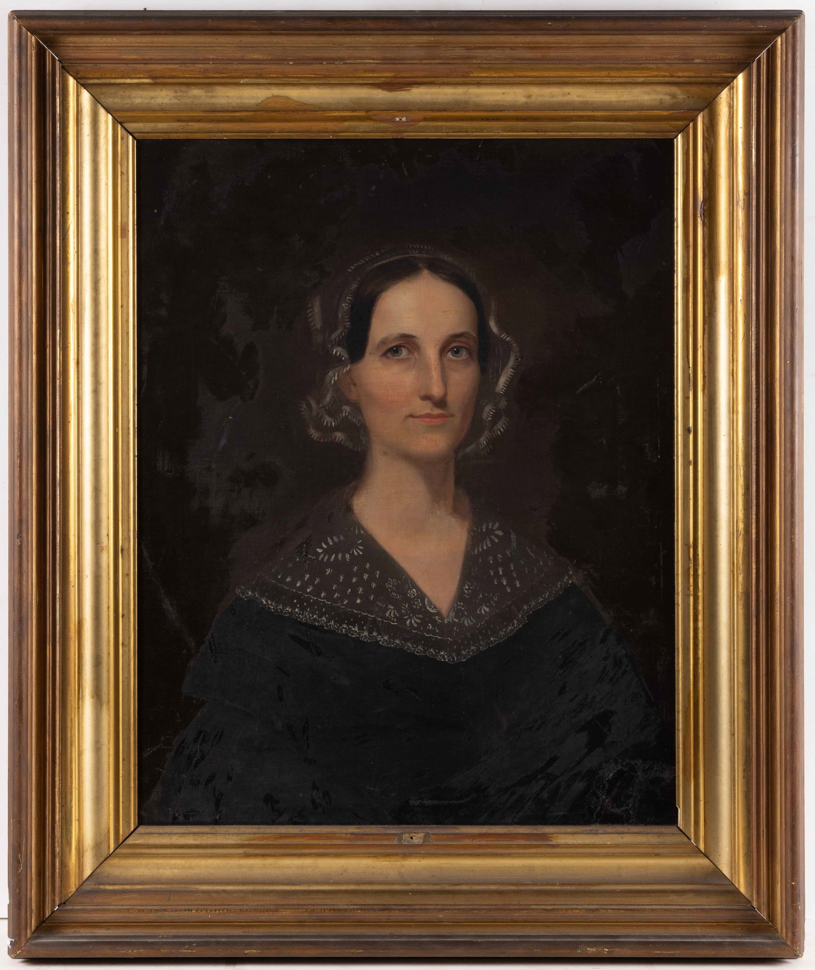 AMERICAN SCHOOL (19TH CENTURY) PORTRAIT OF A VIRGINIA LADY: AMERICAN SCHOOL (19TH CENTURY) PORTRAIT OF A VIRGINIA LADY, oil on canvas, a bust-length depiction of a lady with very dark brown hair and bright blue eyes wearing a lace bonnet which frames her face.