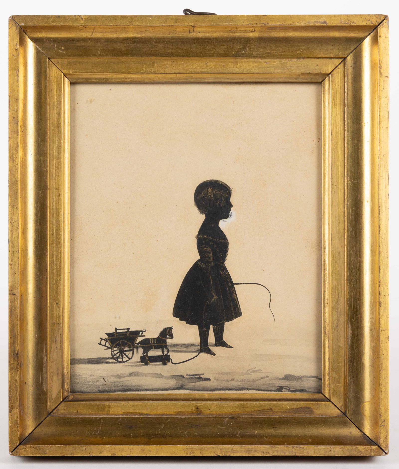 AMERICAN / BRITISH SCHOOL (19TH CENTURY) CUT-AND-PASTED SILHOUETTE: AMERICAN / BRITISH SCHOOL (19TH CENTURY) CUT-AND-PASTED SILHOUETTE, with gouache and watercolor embellishments, and fine gilt detailing, depicting a girl in a dress holding a whip and p