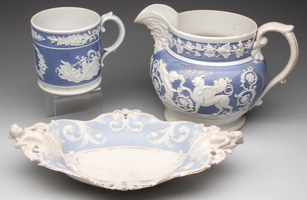RIDGWAY AND MINTON NEO-CLASSICAL ITEMS, LOT OF THREE: RIDGWAY AND MINTON NEO-CLASSICAL ITEMS, LOT OF THREE, comprising a Ridgway pitcher and mug, and a Minton parian dish. The first, a large mug with strap-form, ribbed handle, with a large lavender-blue 