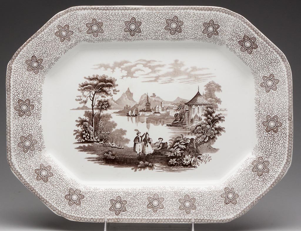 ENGLISH STAFFORDSHIRE IRONSTONE PLATTER: ENGLISH STAFFORDSHIRE IRONSTONE PLATTER, transfer-printed in "Sirius", the canted-cornered platter with shoulders printed with stylized flower heads reserved on the vermiculi ground, centering an exte