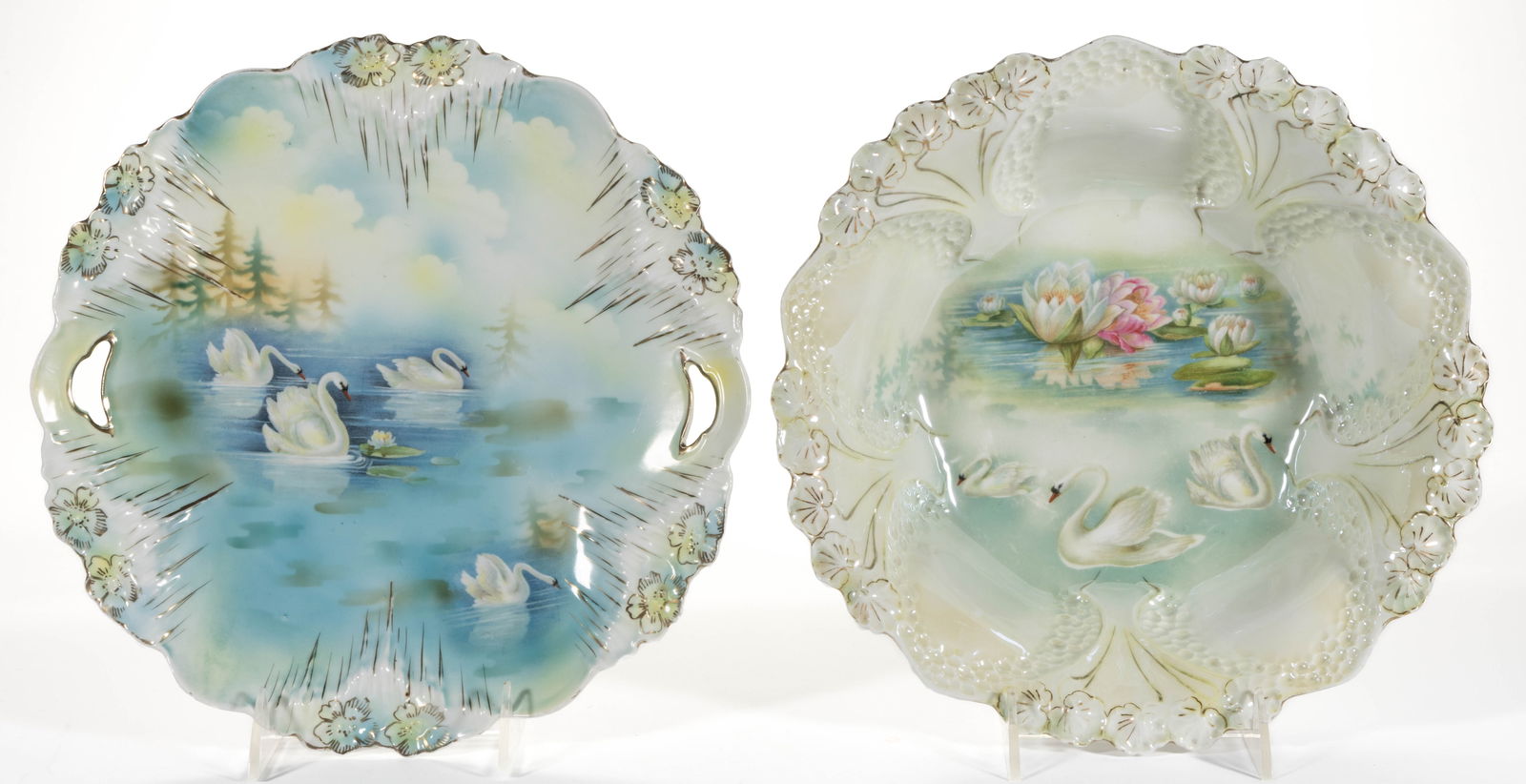 R.S. PRUSSIA PORCELAIN SWAN MOTIF TABLE ARTICLES, LOT OF TWO: R.S. PRUSSIA PORCELAIN SWAN MOTIF TABLE ARTICLES, LOT OF TWO, each having polychrome transfer images, comprising a RSP Mold 7 cake plate depicting swans and water lily with shadow trees and a salad bo