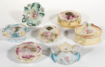R.S. PRUSSIA AND OTHER RELATED PORCELAIN FLORAL MOTIF DRESSER ARTICLES, LOT OF SEVEN