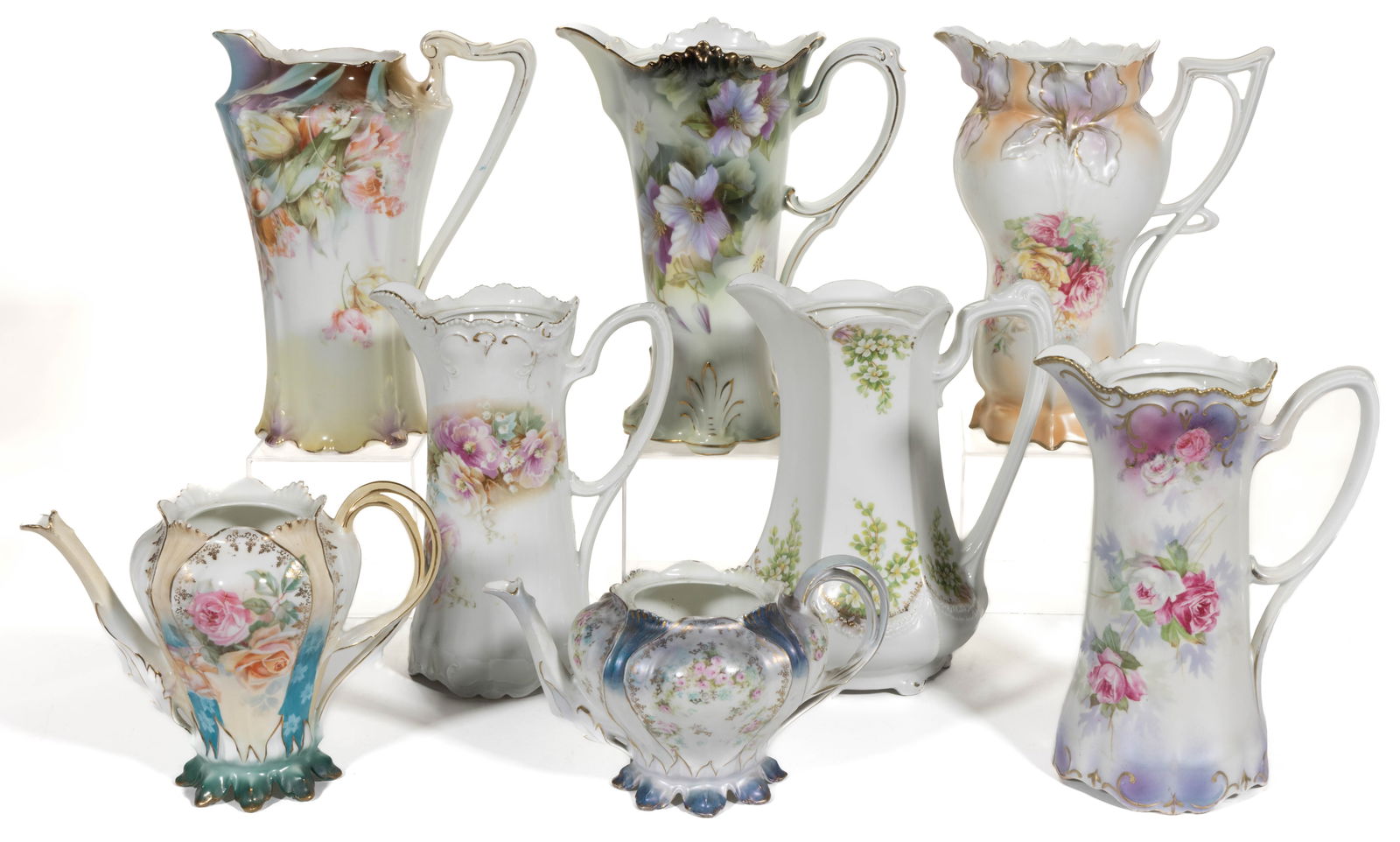 R.S. PRUSSIA PORCELAIN FLORAL MOTIF CHOCOLATE AND TEA POTS, LOT OF EIGHT: R.S. PRUSSIA PORCELAIN FLORAL MOTIF CHOCOLATE AND TEA POTS, LOT OF EIGHT, each lacking cover, comprising two RSP Mold 627 examples including a satin finish teapot and a demitasse pot and