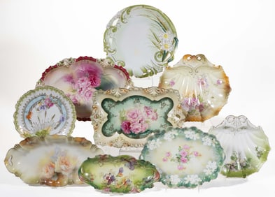 R.S. PRUSSIA PORCELAIN FLORAL MOTIF TRAYS AND OTHER TABLE ARTICLES, LOT OF NINE