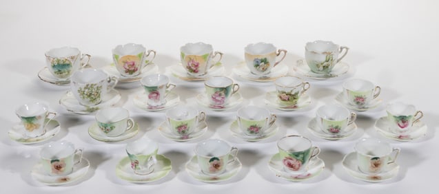 R.S. PRUSSIA PORCELAIN FLORAL MOTIF DIMINUTIVE CUP AND SAUCER SETS, LOT OF 21