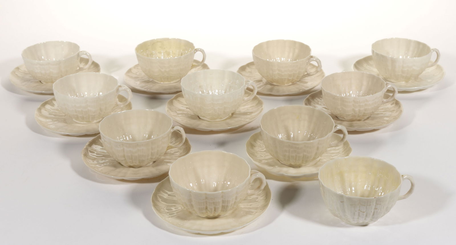 IRISH BELLEEK POTTERY TRIDACNA CUP AND SAUCER SETS, LOT OF TEN (1 of 1)